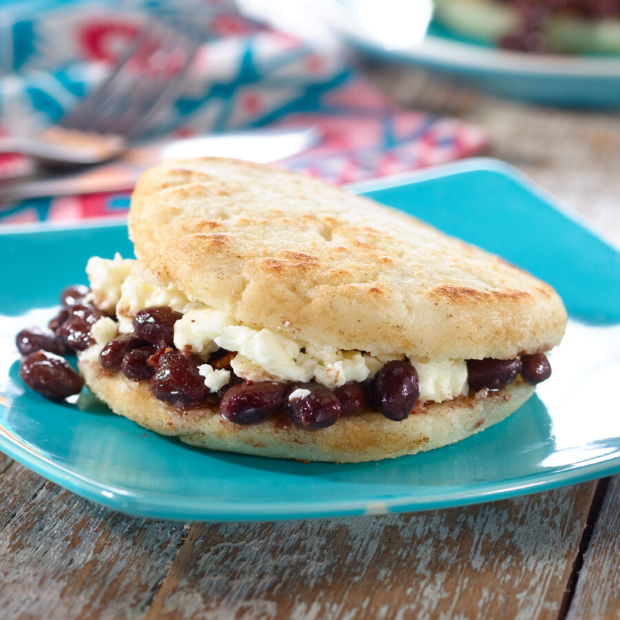 Arepa de Dominó - Venezuelan Corncake filled with Black Beans